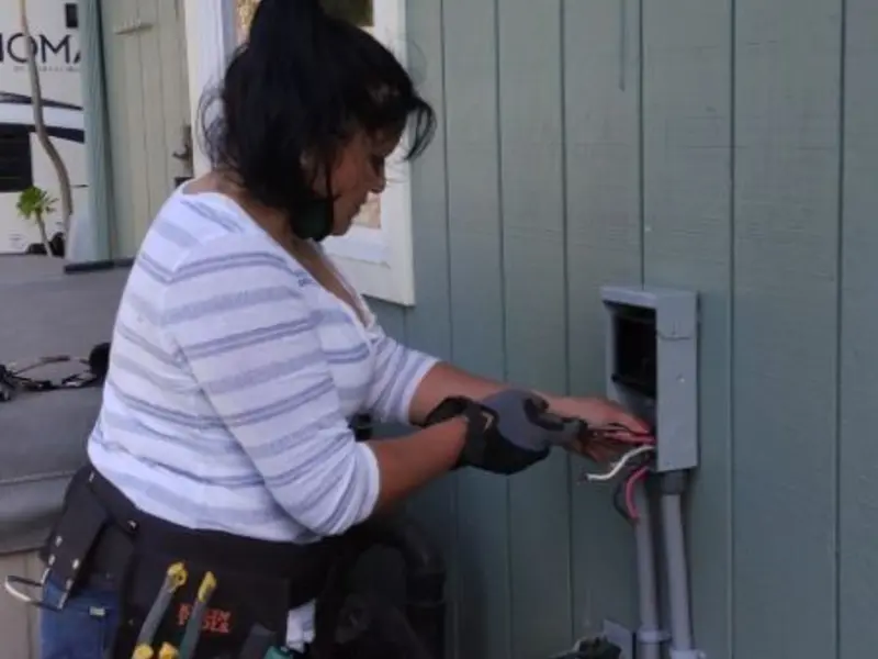 Licensed electrician wiring an exterior subpanel in Ferguson